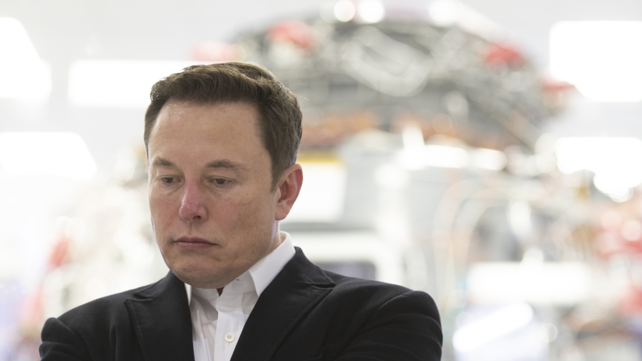 [Image of Elon Musk with sad face]